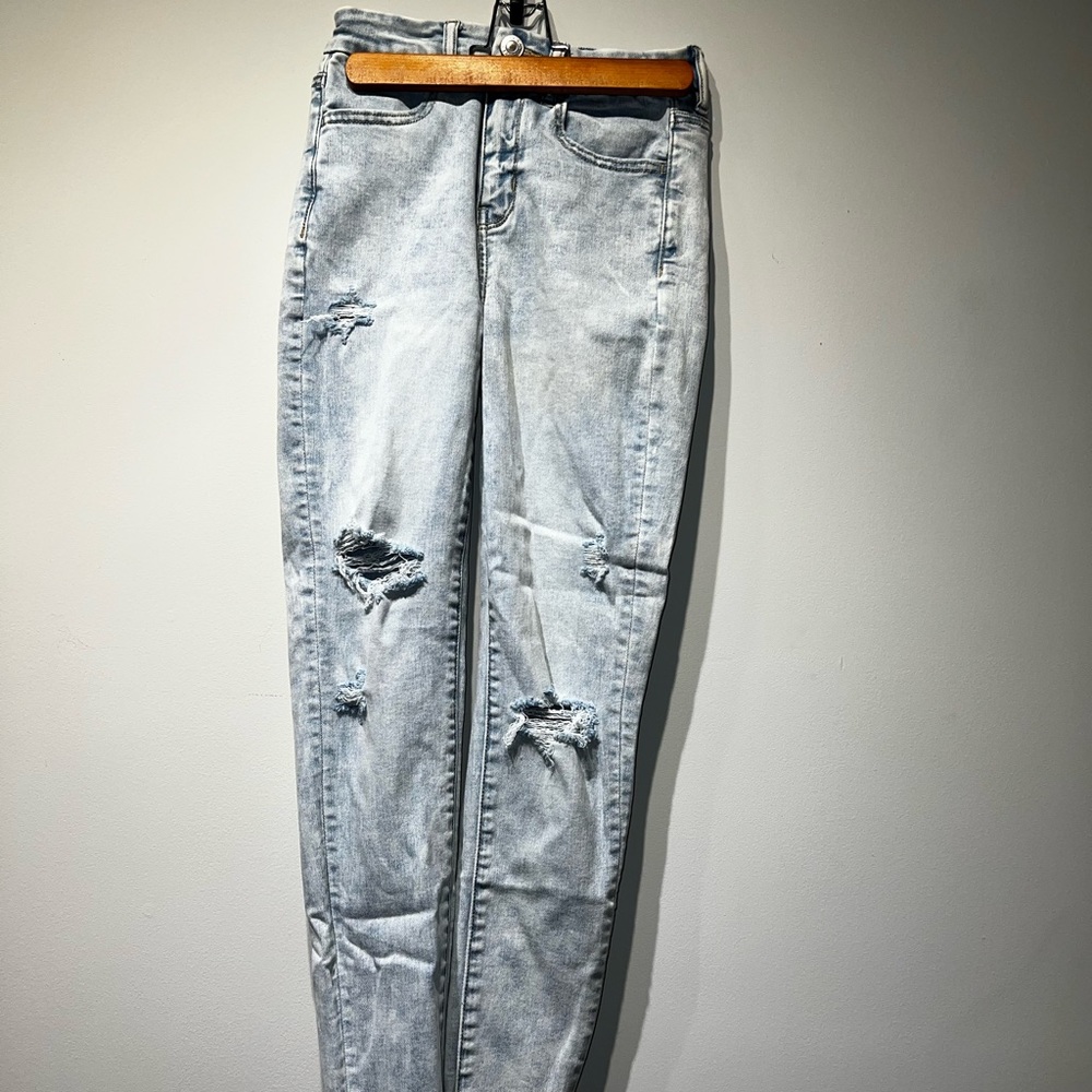 Pale blue skinny high waisted ripped jeans. Like new!